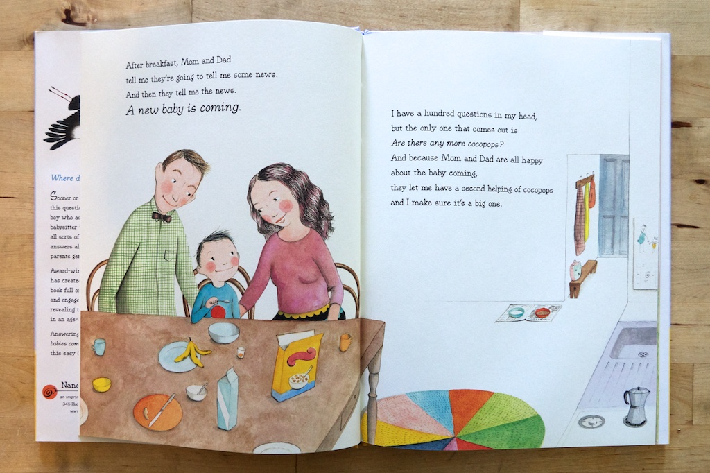 a white dad and mom sit at the table watching their son eat breakfast. 