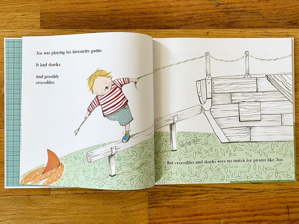 A white boy with one leg is playing on a balance beam near a ship and imagining a shark fin in the grass below.