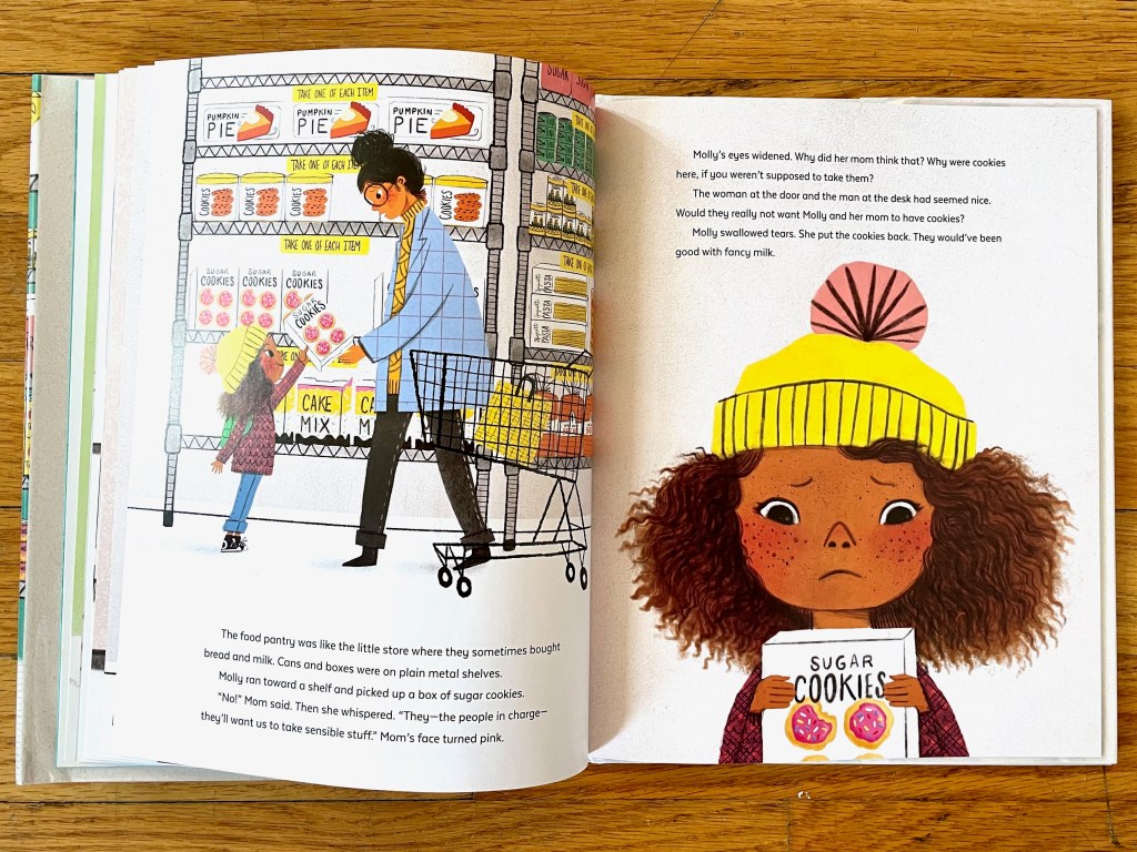 Molly is handing her mom a box of sugar cookies. Her mom stands next to their cart and in front of metal shelves full of food. On the right page, Molly is filling the page from her chest up, holding the box of cookies and looking confused at the box. Molly has tan skin, wavy brown hair and a yellow beanie with a pink pom. 