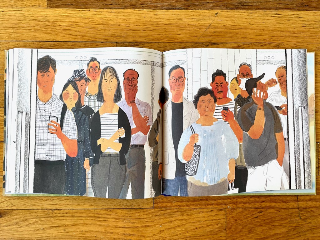 A wordless spread with all the people facing the reader while they ride and wait. Some on their phones, some just standing holding their bags, one in a mask.