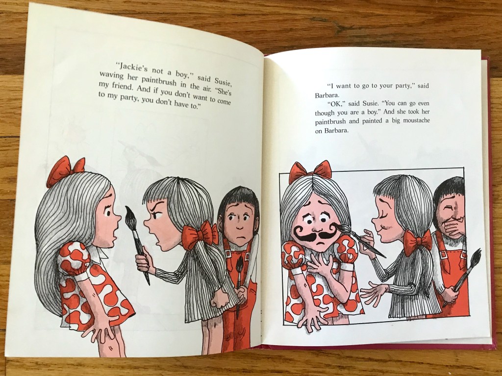 On the left page, the little girl looks angrily at another little girl waving a paintbrush in front of her face. On the right, she has painted a moustache on the little girl's face and Jackie giggles in the background.