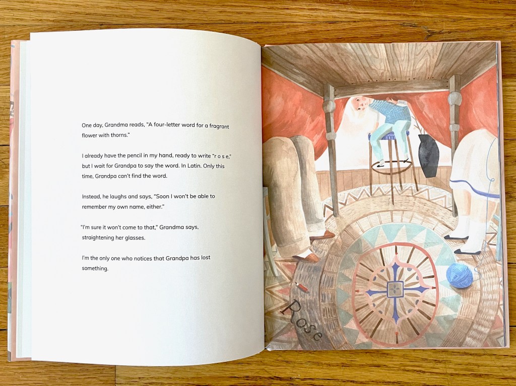 Right page view from under the table as the child peers under the tablecloth looking at a word lost on the floor, a pencil, and the grandma's yarn ball. 