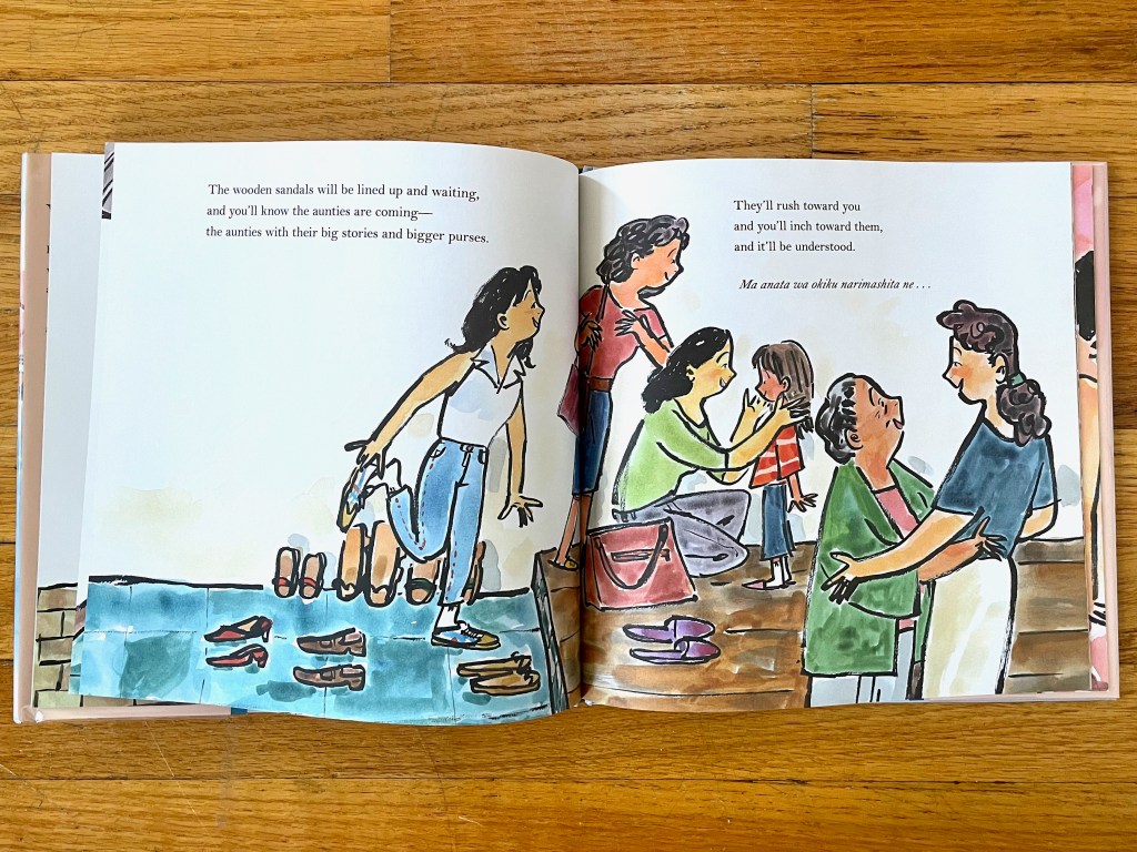 Aunties surround the girl and touch her cheeks. The grandma hugs the mom.