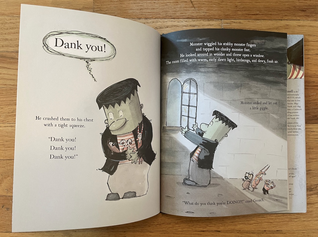 spread from The Monsters' Monster. Big monster is hugging the little monsters on the left page. On the right page he is basking in the light from the window while the other three cower.