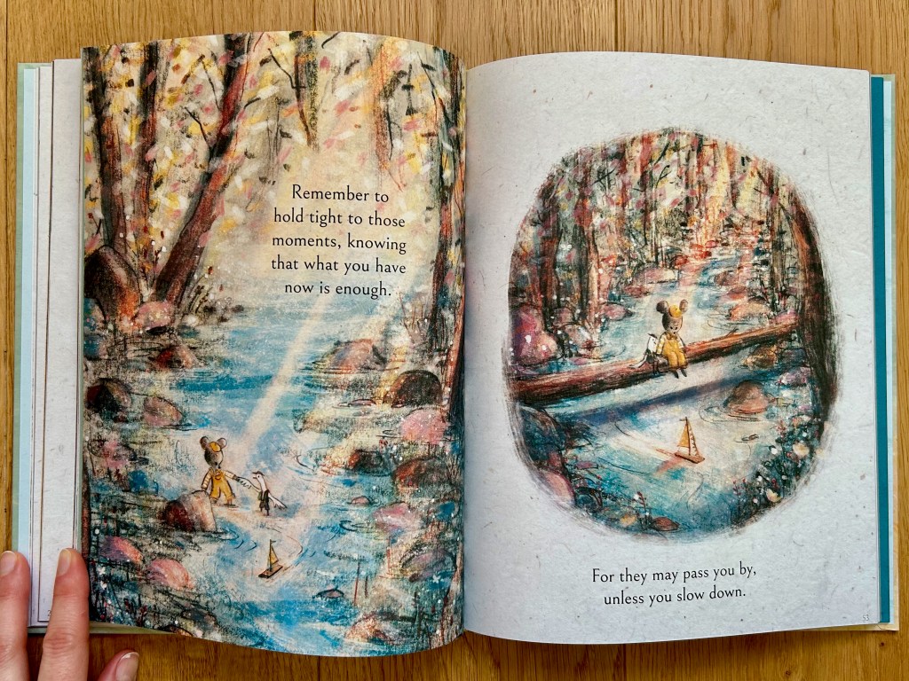 Left page shows the little bear and a duck holding paw and wing while wading through a beautiful shiny river. The right page has them in an oval vignette sitting on a log over the river and watching their little sailboat.