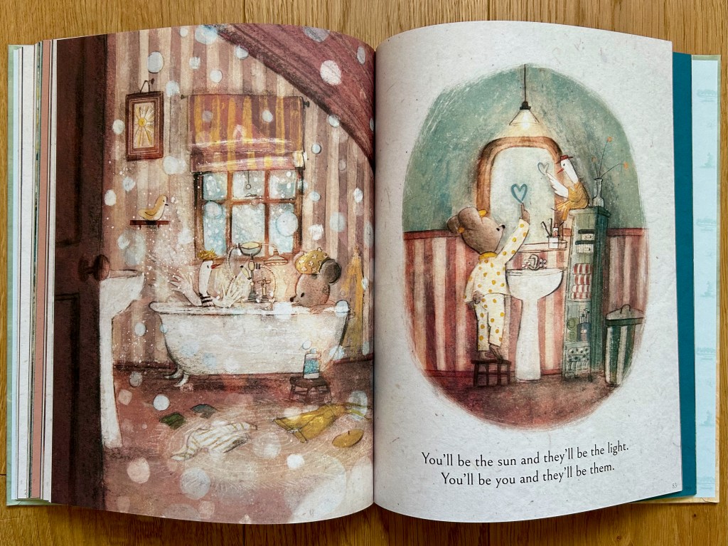 Left page shows the little bear and a duck sharing a bubbly bath. The right page has the two in the bathroom brushing their teeth together at the sink and mirror.