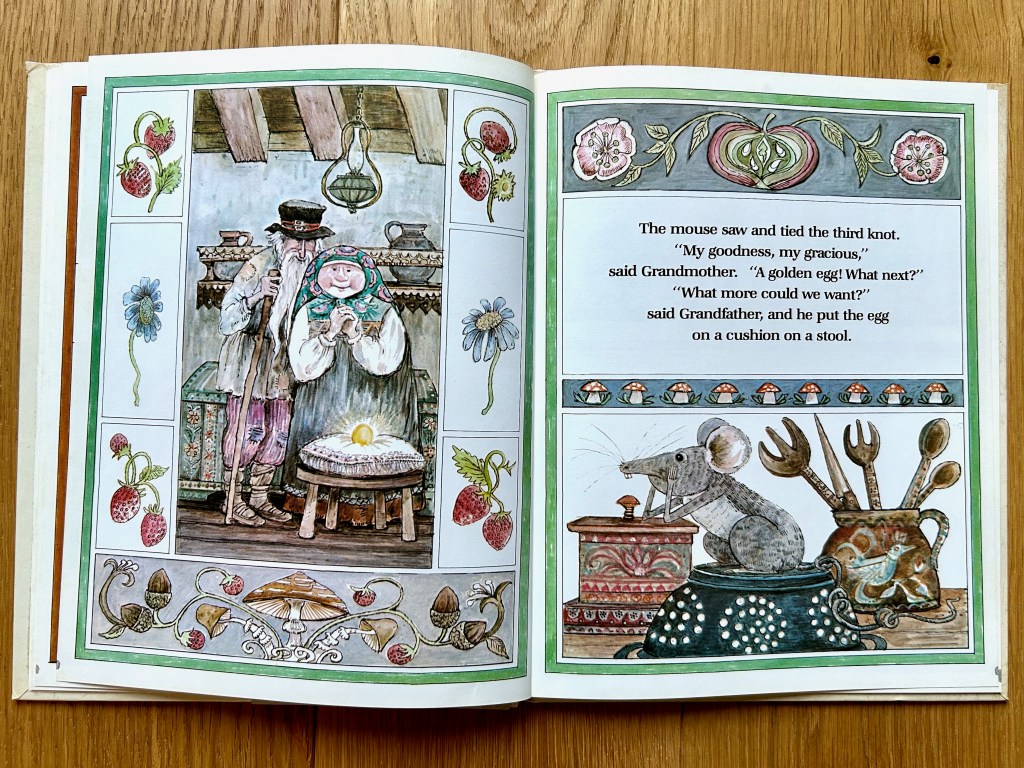 Left page, the grandparents stand together looking pleased at the golden egg on a pillow on a stool. They are bordered by fruits and flowers. Right page, the mouse has his head in his hands watching them with a third knot in his tail.